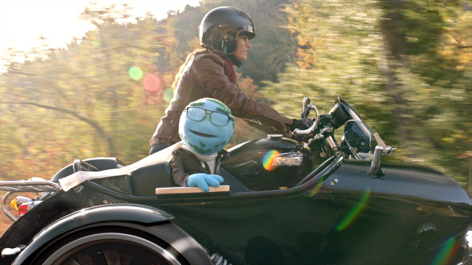 Mr. World riding in motorcycle sidecar — final shot